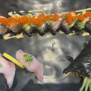 Yellowtail Nigiri, Pink Lady, half eaten spicy scallop hand roll