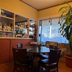 a dining room with a table and chairs