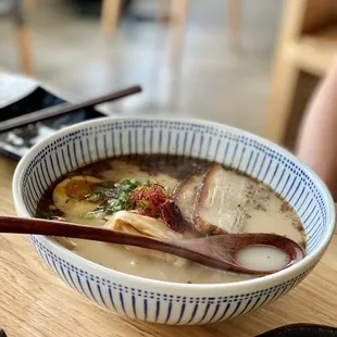 a bowl of ramen and chopsticks