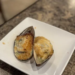 two mussels on a plate