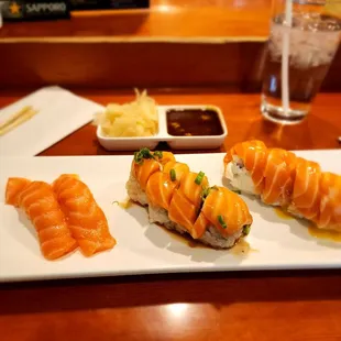 three pieces of sushi on a white plate