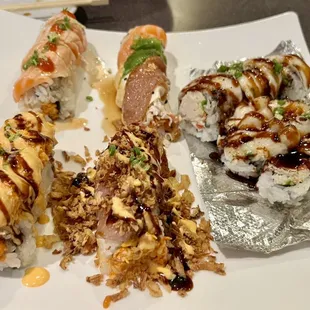 various types of sushi on a plate