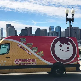 a delivery truck parked on the side of the road