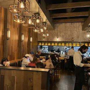 Lively dining scene, gorgeous fixtures/open kitchen