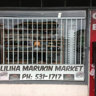 a storefront window with a sign in the window