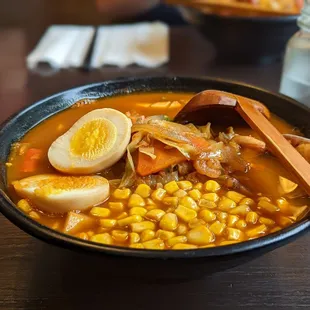 Seafood ramen with added egg and corn