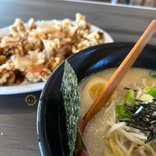 a bowl of ramen and a plate of rice