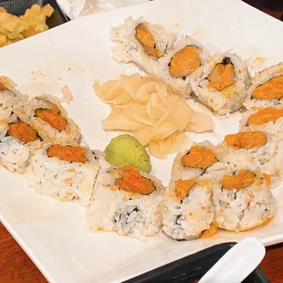 Looks like a child pulled this sushi and put it on a plate!