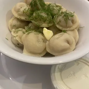 Pierogi with sour cream and dill