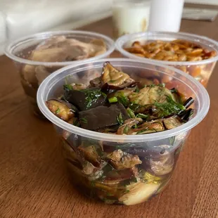 three containers of food on a table