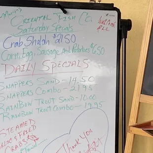 a whiteboard with a list of fish