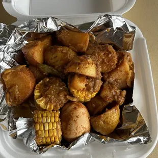 Potato, corn, egg, and sausage side