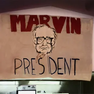 a political sign hanging on a wall