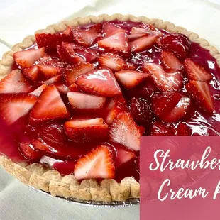 a strawberry cream pie on a table