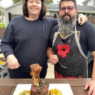 a man and a woman posing for a picture