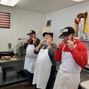 a group of people in a kitchen