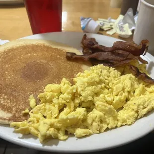 Mary B's breakfast with eggs scrambled, pancake, and bacon (extra crispy as requested)
