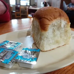 a loaf of bread with a bite taken out of it