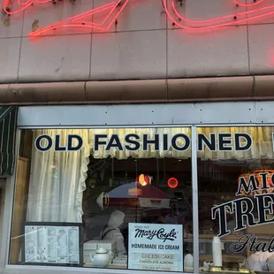 a neon sign in the window