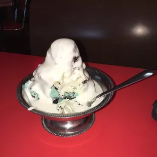 Mint Oreo and cookies and cream ice cream sundae with marshmallow topping.