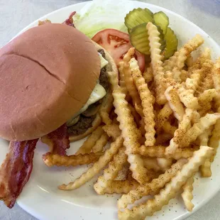 Bacon, swiss &amp; mushroom burger w/seasoned fries.