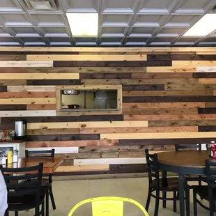 a dining area with tables and chairs