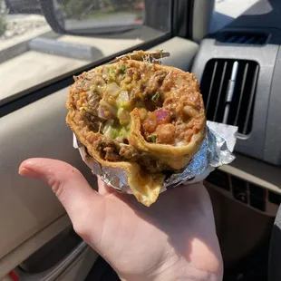 Handful of half a carne asada burrito