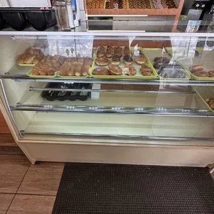 a display case filled with donuts