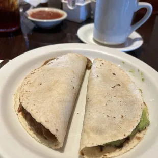 Carne Guisada and Guacamole Taco on Corn tortilla.