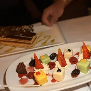 This just showed up - maybe this is their birthday treat? Petit Fours had different cakes inside.