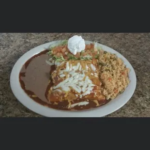 Mexican plate 3 enchiladas, beans, rice, and salad