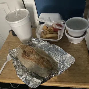 Carne Asada Burrito with a side of fries, 32oz Horchata and two 8oz containers of sauce.