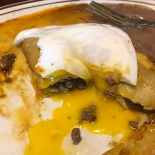 Beef enchiladas with over easy eggs. Just ask for it.