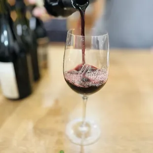 wine being poured into a glass