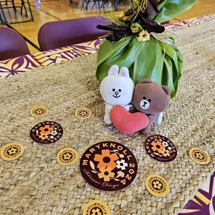 Centerpiece and stickers at the Annual Alumni Luau 2024