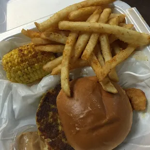 Crabcake sandwich w/ remoulade sauce, corn and fries. Oh and a cpl shrimp in there too!