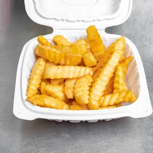 french fries in a styrofoam container