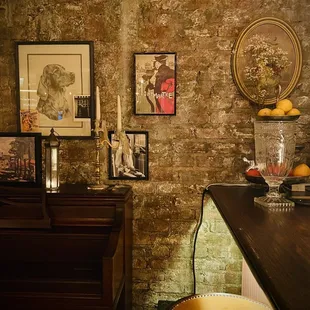 a brick wall with pictures on it