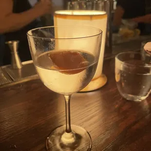 a glass of wine on a table