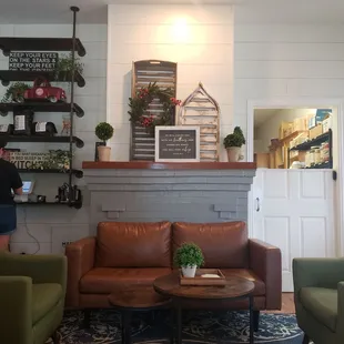 Nice seating area &amp; cute decor, there are also dining tables on the opposite side with additional tables outside on the porch.