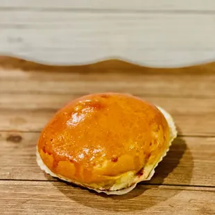 a half eaten pastry on a wooden table