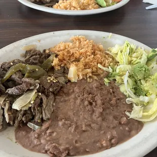 Fajita plate, comes with beans, rice, salad, and tortillas!
