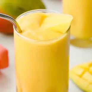 a glass of mango smoothie