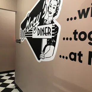 a woman holding a sign