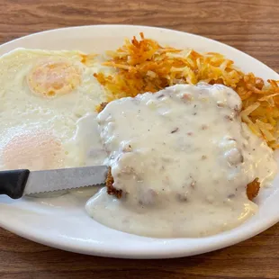 Chicken fried steak, over easy eggs and hash browns.