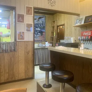 Bar stools or tables, with view into the kitchen