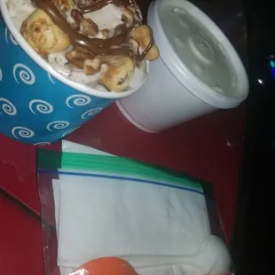 Rolled Icecream togo along with elote in cup togo. They gave me spoons and napkins in a little zip lock :)