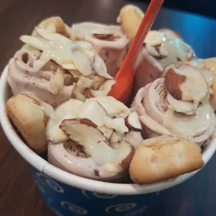 Banana nutella mix in , with almonds, panda cookies and condensed milk as the 3 toppings.