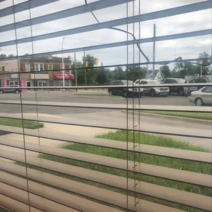 a view of a street through a window