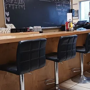 The bar and a menu board.